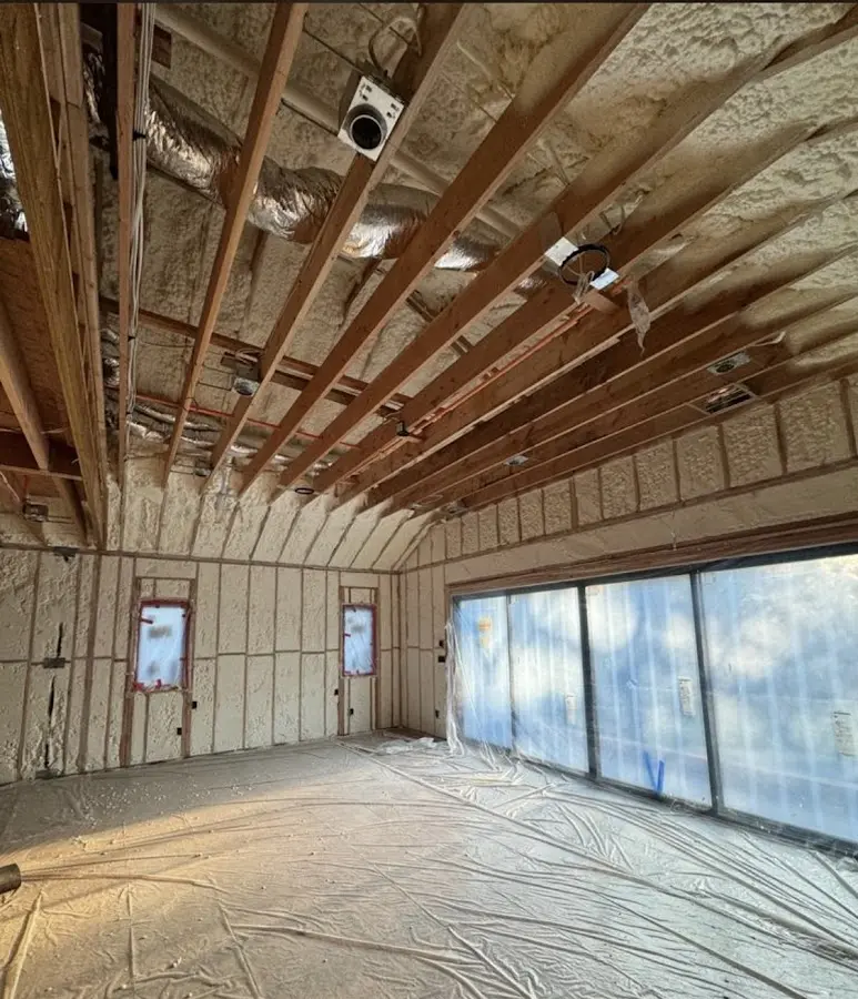 Interior walls and ceiling insulated with spray foam during new construction in Laie